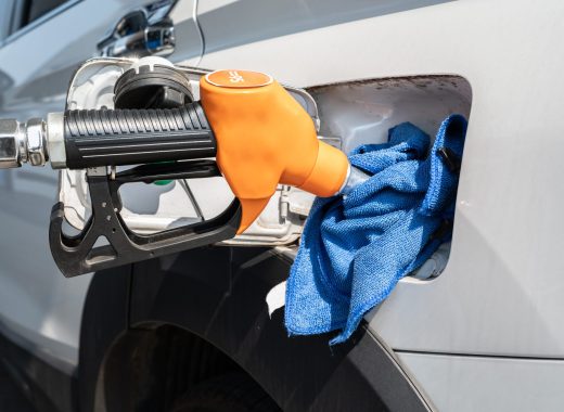 vecteezy_an-orange-nozzle-while-refueling-gasoline-to-fuel-tank-of_6877349